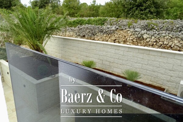 photo 6 Krk, a three-bedroom apartment with a living area 120m2, garden, and basement